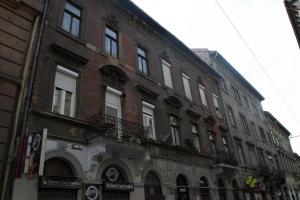 a large brick building on a city street at Akacfa 2 bedroom center apartment in Budapest