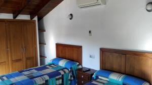 Postel nebo postele na pokoji v ubytování Casita la Herilla