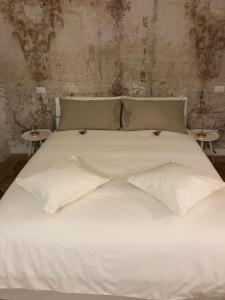 Posteľ alebo postele v izbe v ubytovaní Rapanus Suites