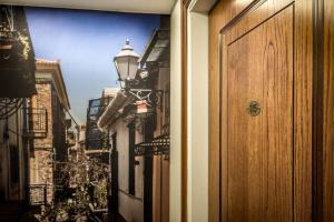 a view of an alley with a door and a street at Rex Hotel in Nafplio