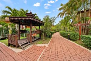 a gazebo sitting on a brick walkway at Pinnacle Samui Resort in Mae Nam