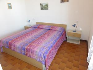 Ένα ή περισσότερα κρεβάτια σε δωμάτιο στο Villa Comete