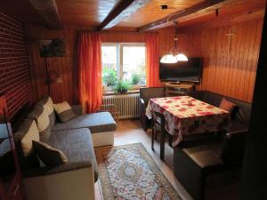 a living room with a couch and a table at Haus Antonis in Triberg