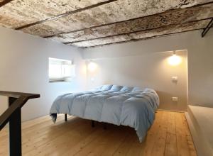 A bed or beds in a room at Il Coro delle Nuvole
