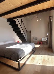 A bed or beds in a room at Il Coro delle Nuvole