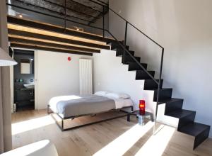 A bed or beds in a room at Il Coro delle Nuvole