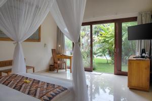 TV a/nebo společenská místnost v ubytování Santun Luxury Private Villas