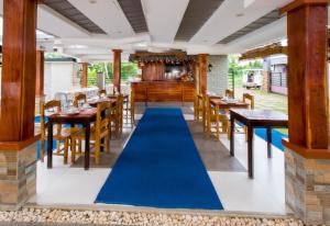Restaurant o un lloc per menjar a Greenfields Tourist Inn