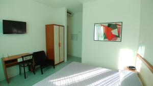 A television and/or entertainment centre at Hotel Marta
