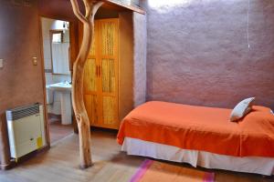 Ένα ή περισσότερα κρεβάτια σε δωμάτιο στο Hotel Kimal