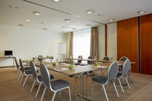 a conference room with a long table and chairs at Sunday Hotel Stuttgart Herrenberg in Herrenberg