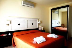 Postel nebo postele na pokoji v ubytování Hotel Orizzonte