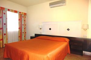 Postel nebo postele na pokoji v ubytování Hotel Orizzonte