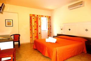 Postel nebo postele na pokoji v ubytování Hotel Orizzonte