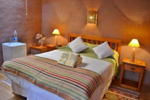 Ένα ή περισσότερα κρεβάτια σε δωμάτιο στο Hotel Kimal