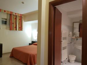 Postel nebo postele na pokoji v ubytování Hotel Orizzonte