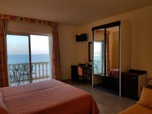 Postel nebo postele na pokoji v ubytování Hotel Orizzonte