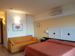 Postel nebo postele na pokoji v ubytování Hotel Orizzonte