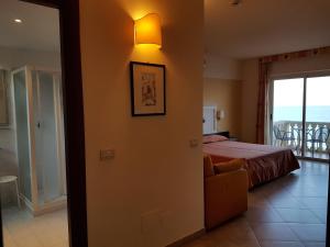 Postel nebo postele na pokoji v ubytování Hotel Orizzonte