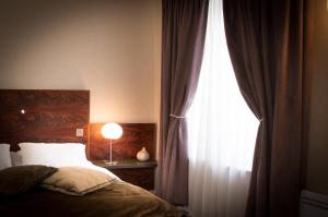 Postel nebo postele na pokoji v ubytování Hôtel & Restaurant Le Relais d'Aumale