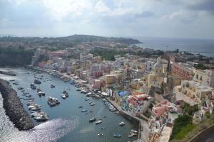 an aerial view of a harbor with boats in the water at Terra Murata Boutique b&b in Procida