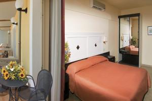 Postel nebo postele na pokoji v ubytování Hotel Orizzonte