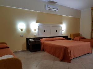 Postel nebo postele na pokoji v ubytování Hotel Orizzonte