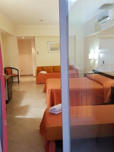 Postel nebo postele na pokoji v ubytování Hotel Orizzonte