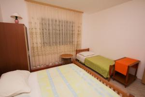 Posteľ alebo postele v izbe v ubytovaní Apartment Fish