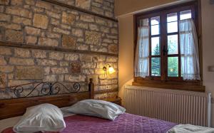Voodi või voodid majutusasutuse Guesthouse Gonia toas