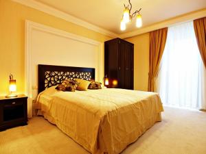 Posteľ alebo postele v izbe v ubytovaní Hotel Fajkier