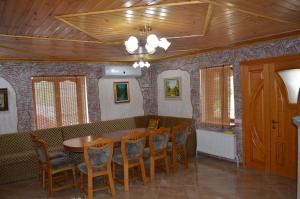 a dining room with a table and chairs at Villa Ana in Rezina