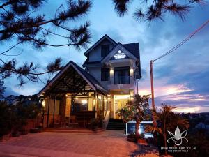 a house with lights on top of it at night at The Orchid Villa Dalat in Da Lat