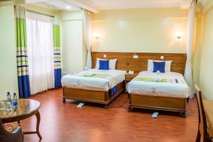 Postel nebo postele na pokoji v ubytování Eastmark Hotel