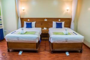 Postel nebo postele na pokoji v ubytování Eastmark Hotel