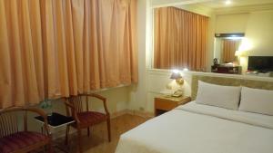 Postel nebo postele na pokoji v ubytování 苓雅大飯店 Lingyea Hotel + 24 fotografií