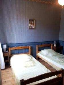 A bed or beds in a room at Château Bel-Air