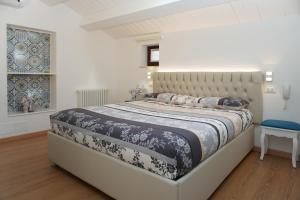 Ліжко або ліжка в номері Casa Vacanze Torre dei Gualtieri