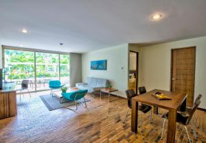 a living room with a couch and a table and chairs at Estelar Playa Manzanillo - All inclusive in Cartagena de Indias +68 photos