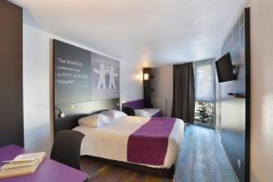 
A bed or beds in a room at Suite Home Briancon Serre Chevalier
