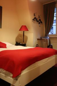 Letto o letti in una camera di Hostellerie de Genève