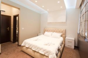 Letto o letti in una camera di Centrum Sobe Rooms Čačak