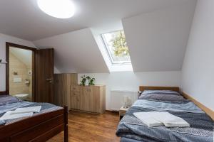 Una cama o camas en una habitación de Attic Rooms Tábor