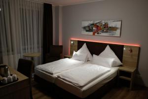 Postel nebo postele na pokoji v ubytování Minx – CityHotels