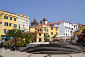 a group of buildings with stairs in a city at Central Suite in Funchal 2N in Funchal
