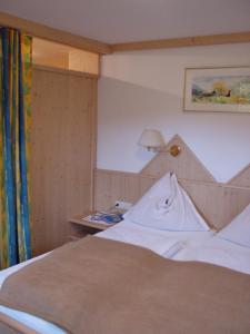 Łóżko lub łóżka w pokoju w obiekcie Pension - Bauernhof
