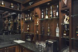 a bar with many bottles of alcohol on the wall at Hotel Inter in Bielany Wrocławskie