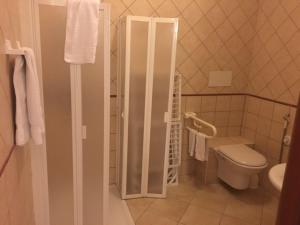 a bathroom with a toilet and a shower in it at Residence Villa Candida in Vieste +19 photos