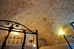 A bed or beds in a room at Maison MilleOttocento