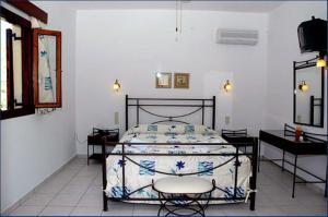 Ein Bett oder Betten in einem Zimmer der Unterkunft Porto Merika